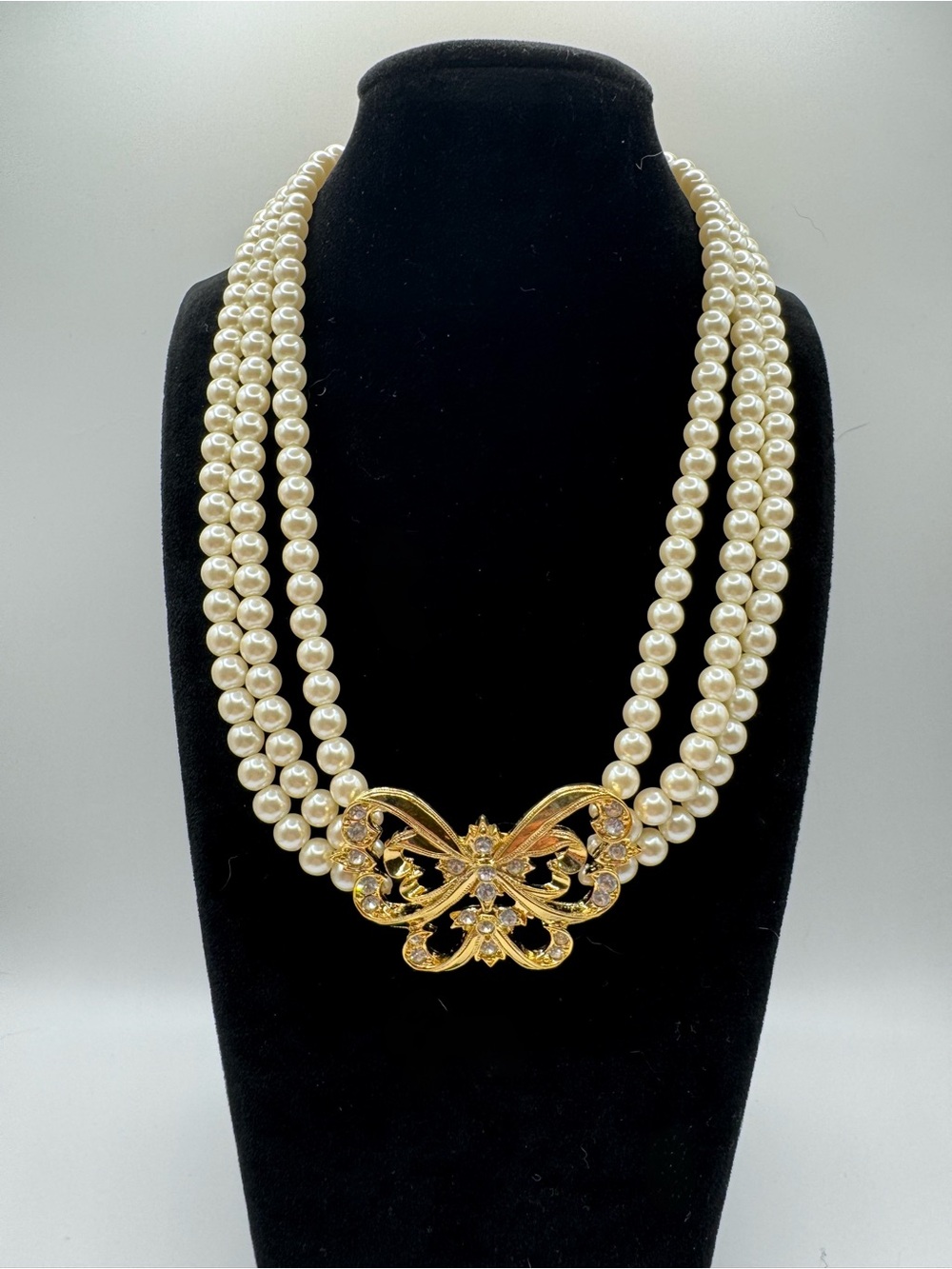 Pearl Triple-Strand Necklace with Gold Butterfly Accent